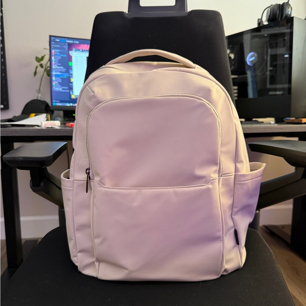 Away Commuter Backpack with Trolley Sleeve in Cream